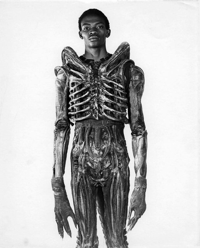 bolaji badejo a 7 foot nigerian design student and one time actor is wearing his costume from the now classic sci fi thriller alien in 1978 825x1024 - Bolaji Badejo, a 7-foot Nigerian design student and one-time actor is wearing his costume from the now classic sci-fi thriller Alien in 1978.